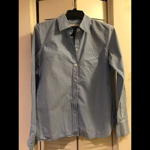 Blue and white pinstriped man-tailored blouse